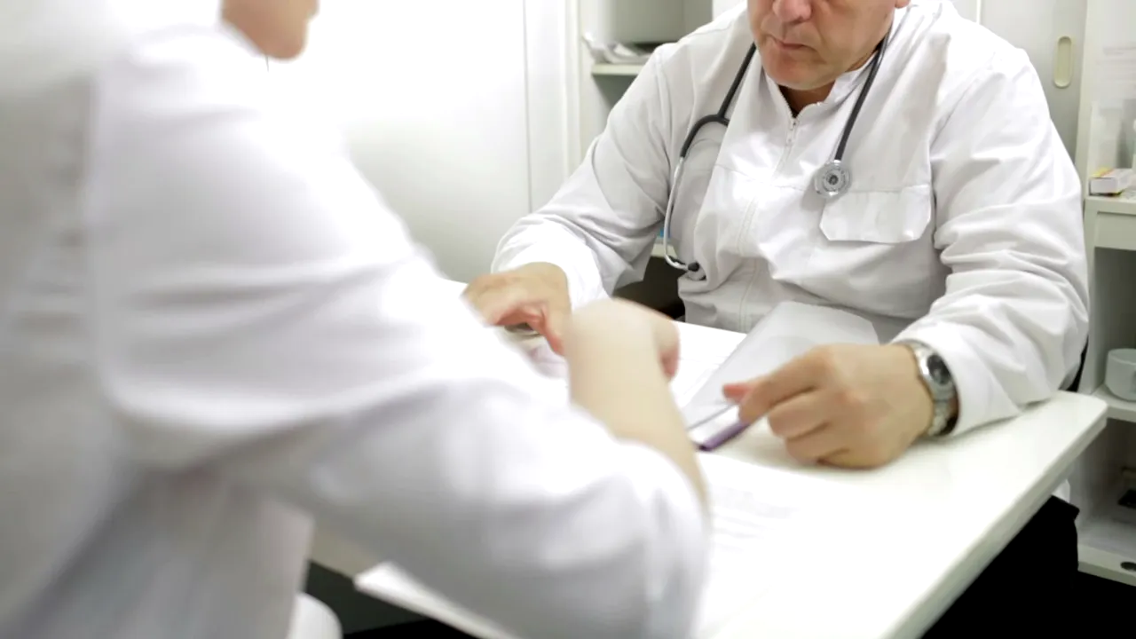 Two people comparing options together at a table