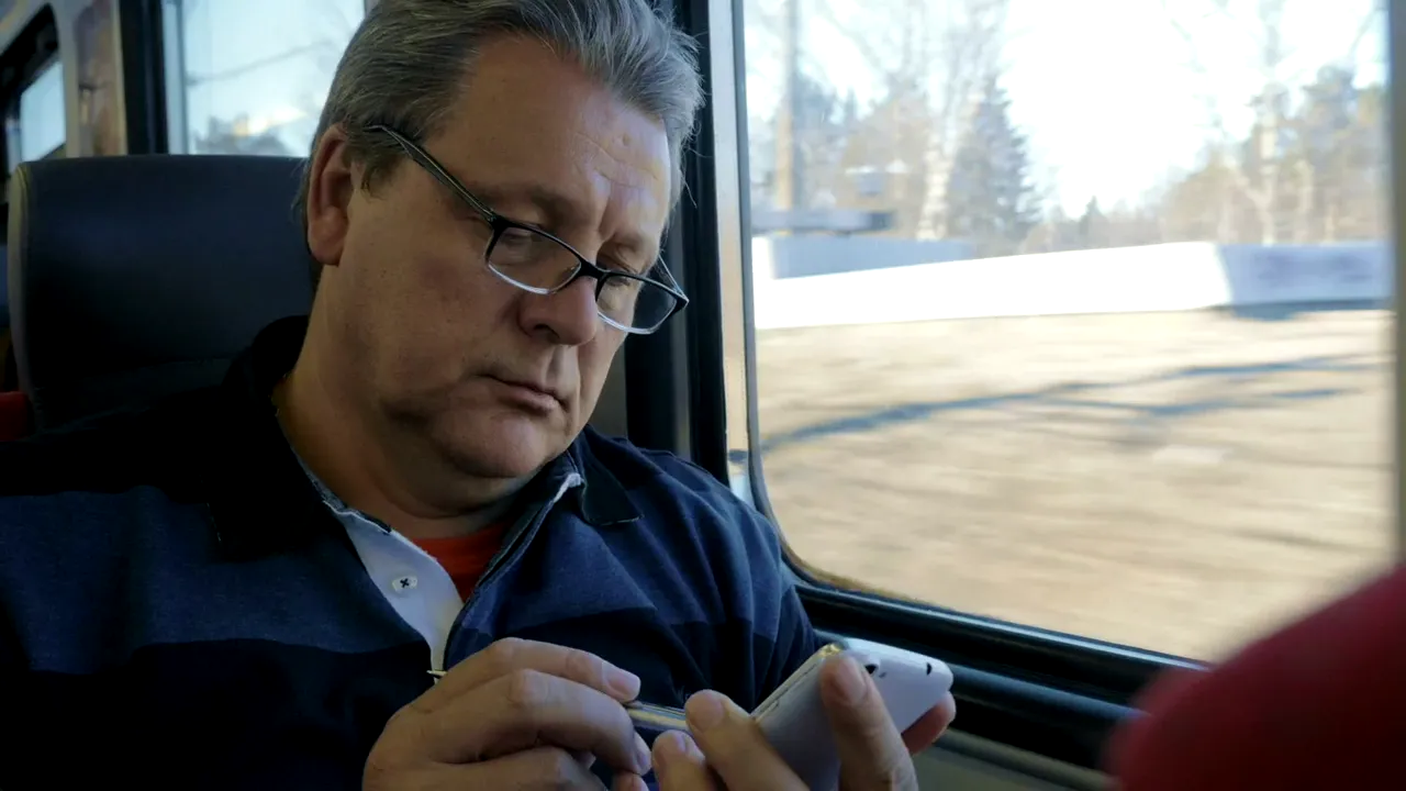 A man on a phone call at home
